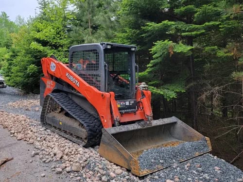 Skid Steer Smoothing Heavy Gravel