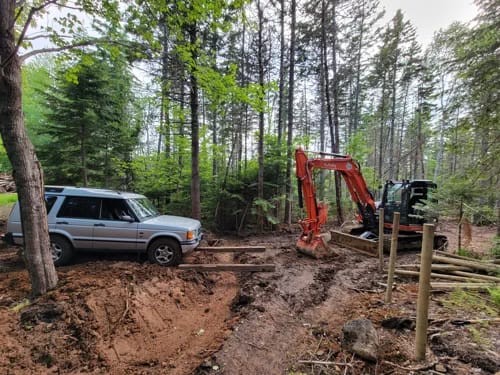 Timber Bridge Truck And Backhoe