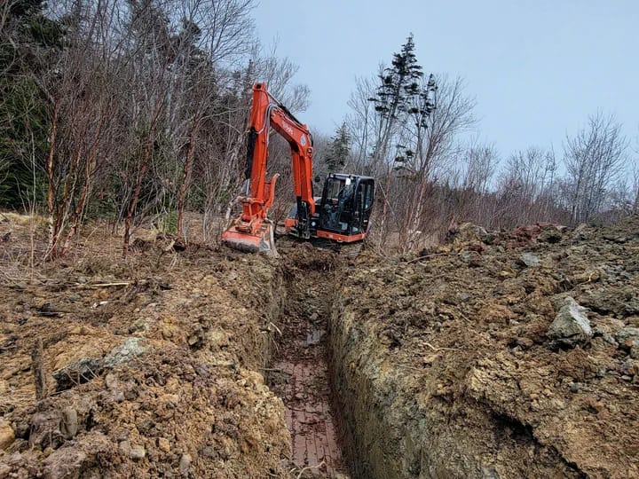 Backhoe Digging Trench